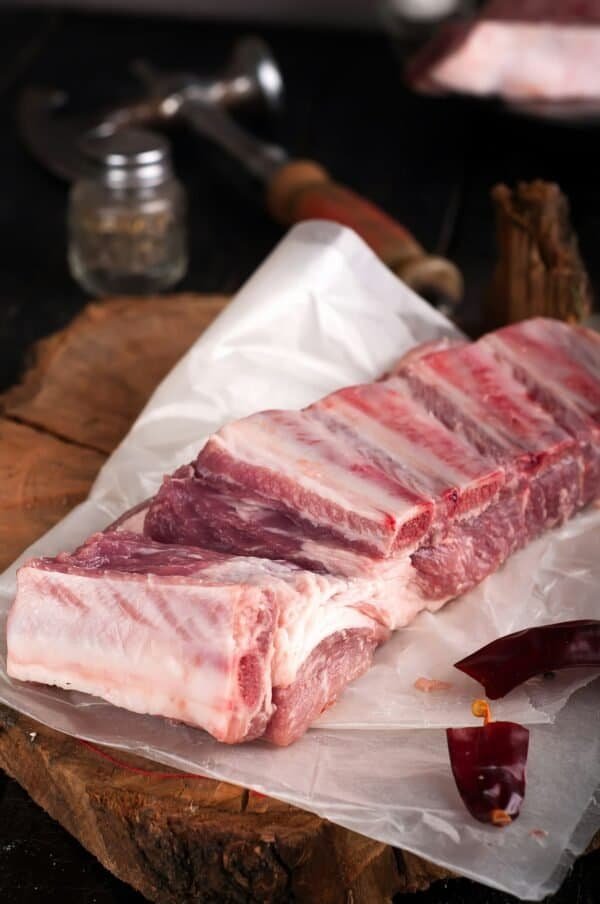 Raw ribs on a wooden table